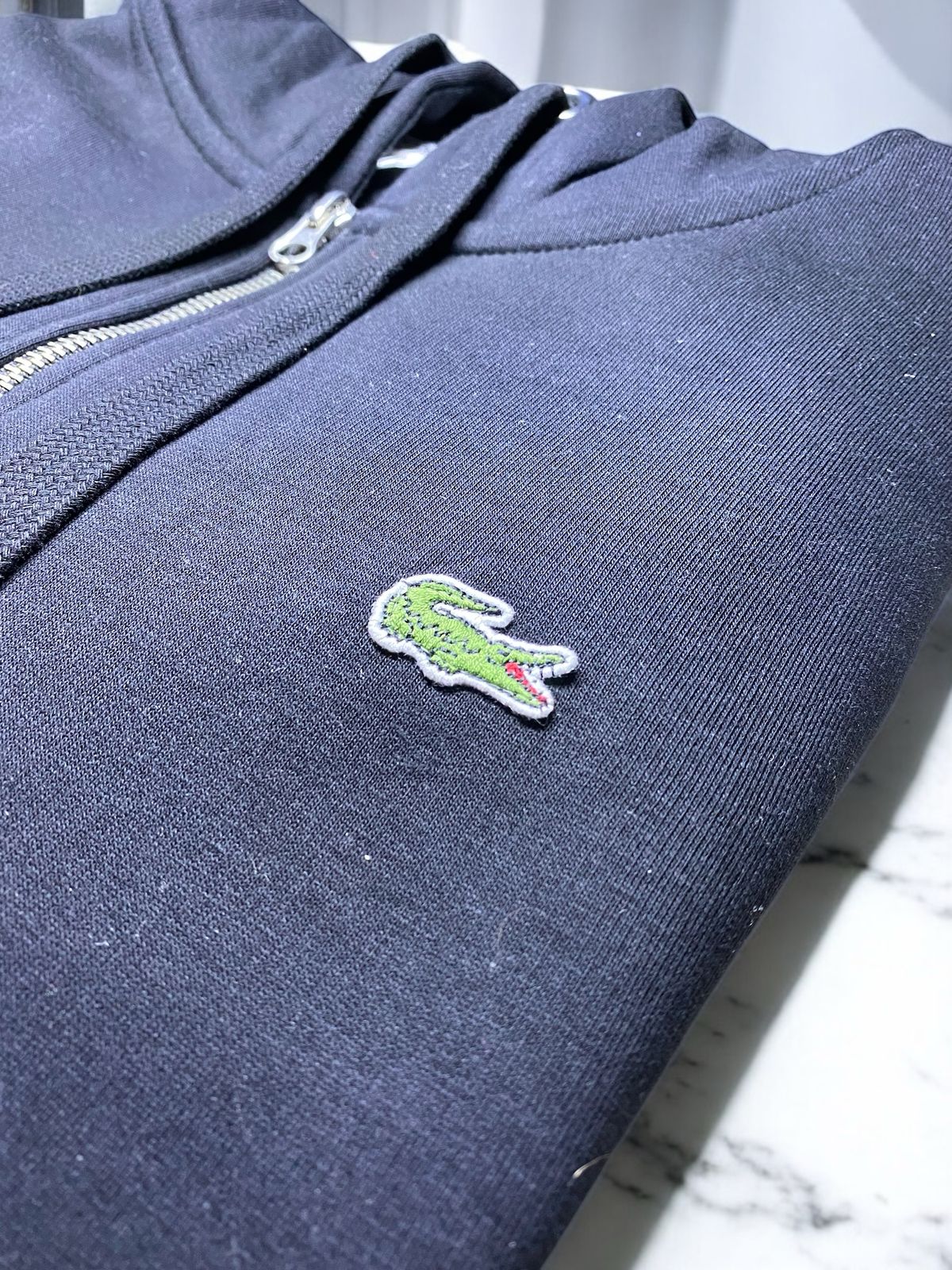 Polerón Lacoste